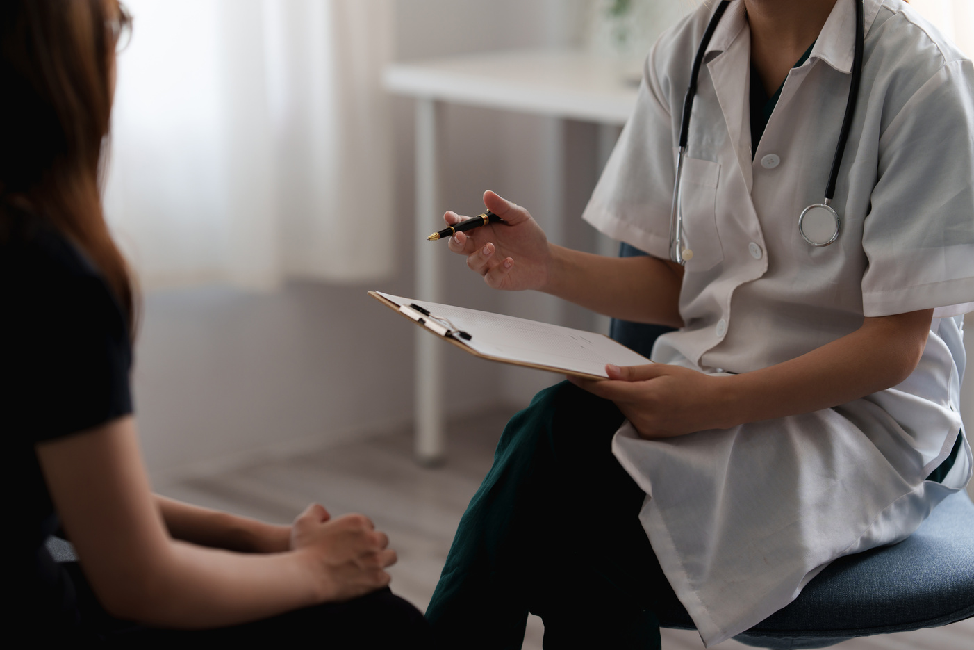 Doctor Consulting Patient and Offer Healthy Food Nutrition at Cl